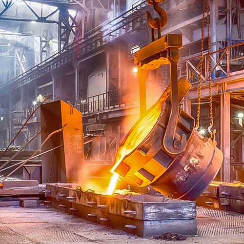 molten metal bucket pouring metal into a cast